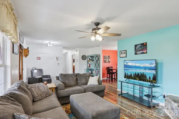 a living room with furniture and a flat screen tv