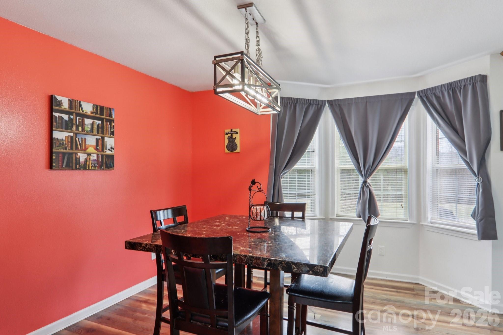 130 Crestview Street Canton, NC 28716 - Photo 14 of 42 a view of a dining room with furniture window and wooden floor
