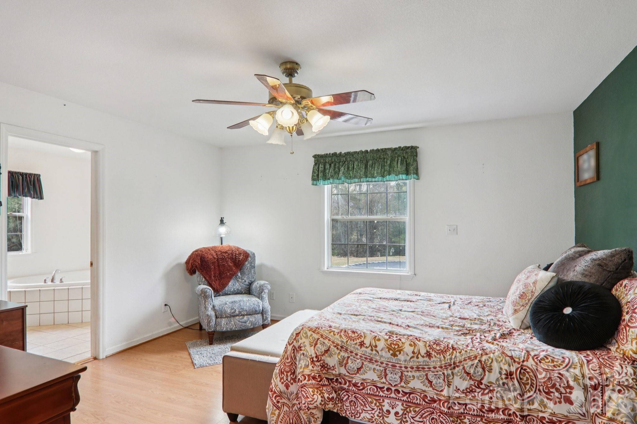 130 Crestview Street Canton, NC 28716 - Photo 23 of 42 a bedroom with a bed and a window
