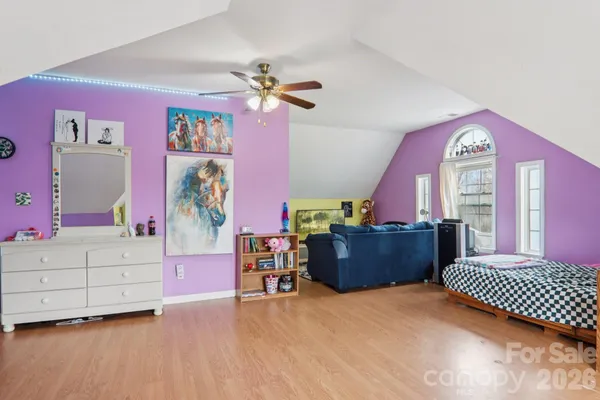 a bedroom with furniture and a dresser