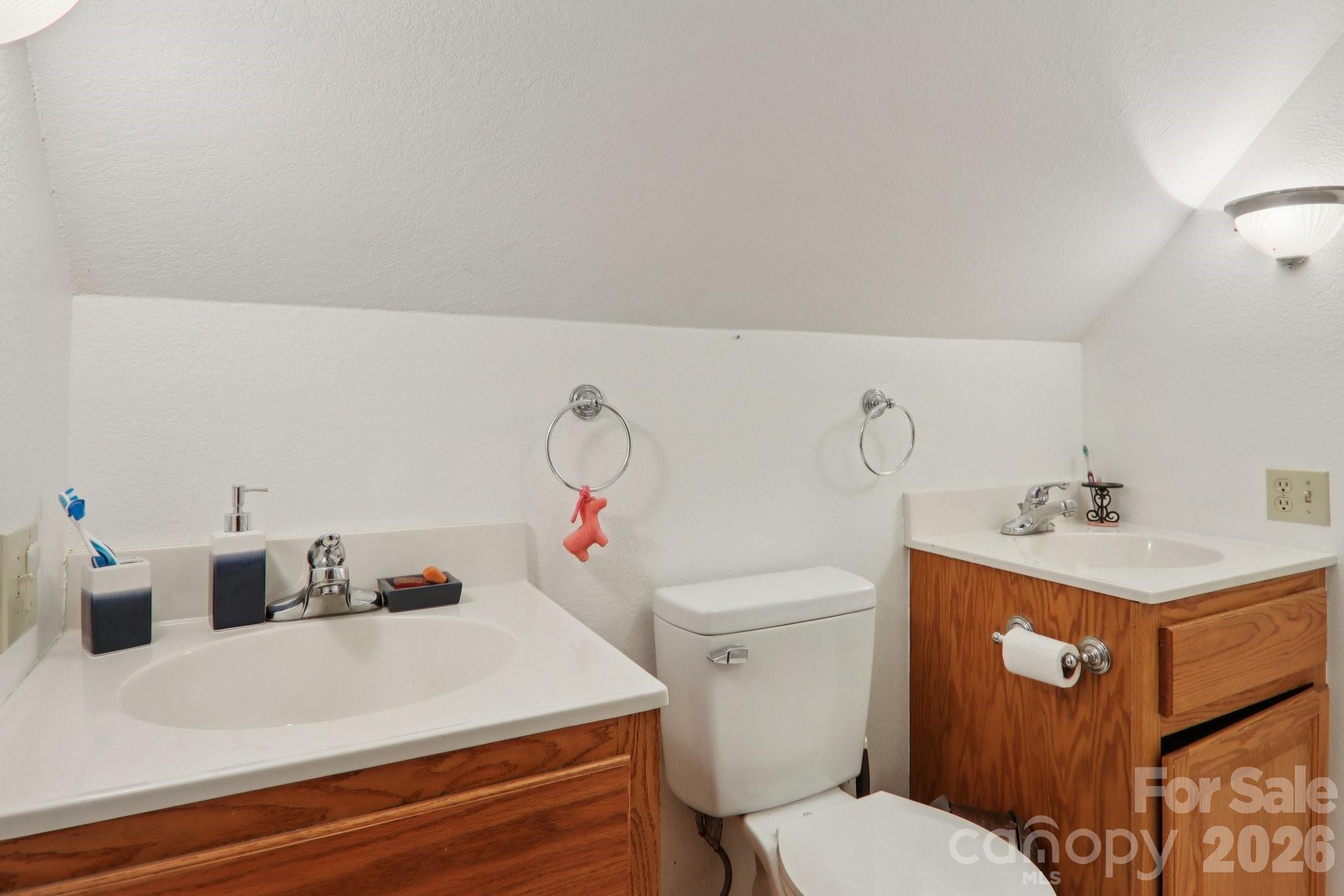 130 Crestview Street Canton, NC 28716 - Photo 38 of 42 a bathroom with a sink vanity granite and toilet