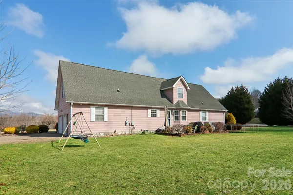 a front view of house with a garden and entertaining space