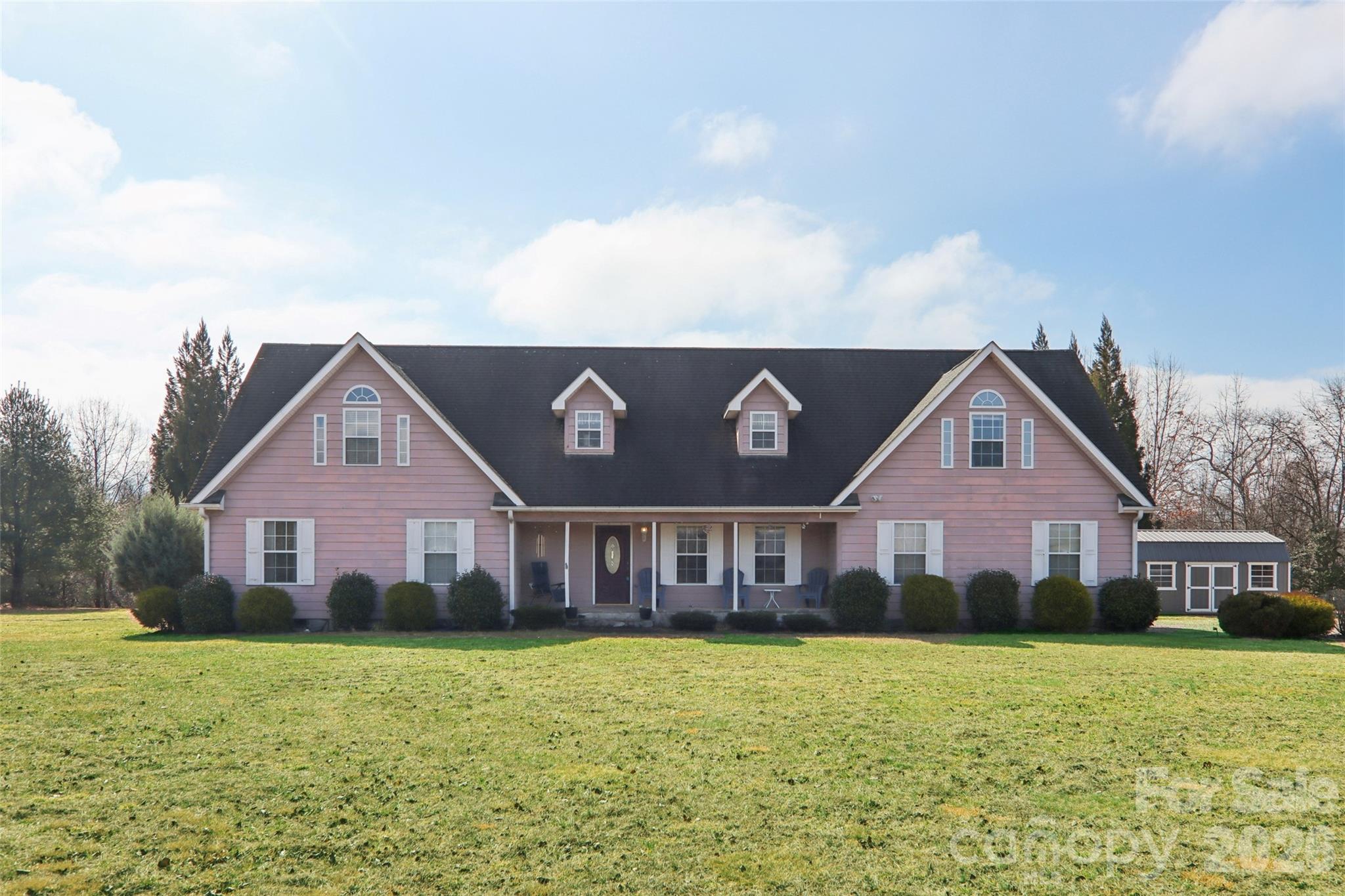 130 Crestview Street Canton, NC 28716 - Photo 5 of 42 a front view of house with yard and seating space