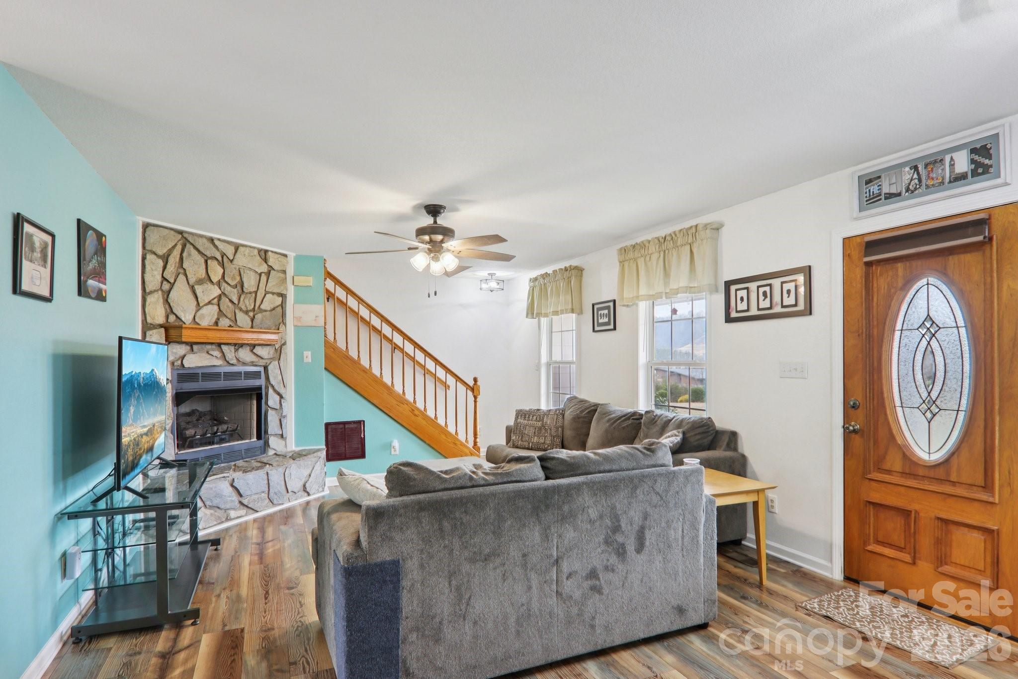 130 Crestview Street Canton, NC 28716 - Photo 10 of 42 a living room with furniture and a flat screen tv