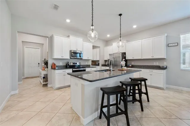 a view of a hallway with wooden floor and closet