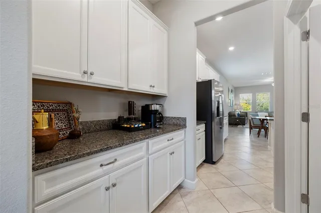 a living room with furniture a rug and a window