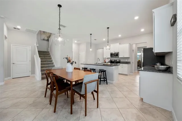 a white toilet sitting next to a bath tub