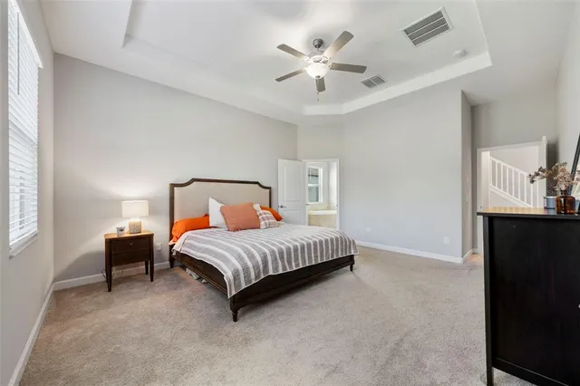 an aerial view of a house with a swimming pool