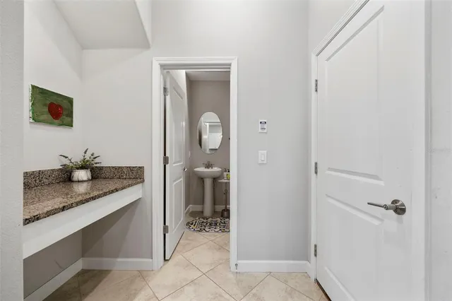 an aerial view of a house with a garden