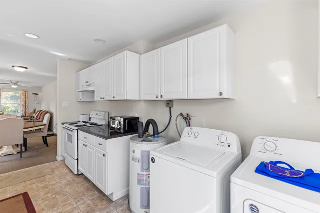 a kitchen that has a sink and a stove
