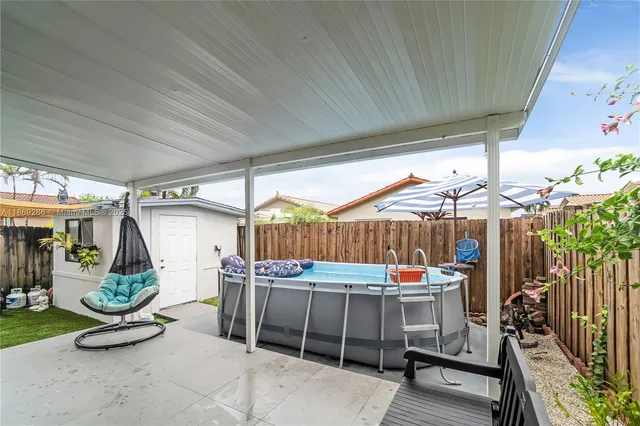 a view of a garage with table and chairs