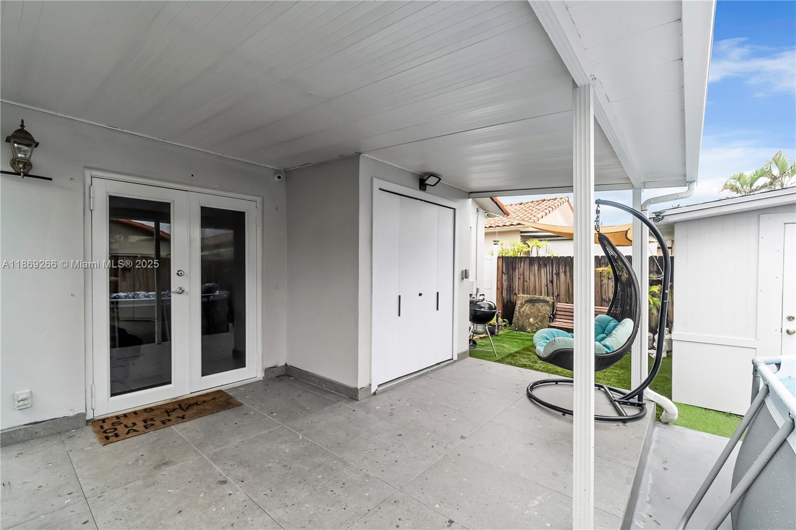 980 West 43rd Place, Unit 980 Hialeah, FL 33012 - Photo 16 of 17 a view of a porch with seating space
