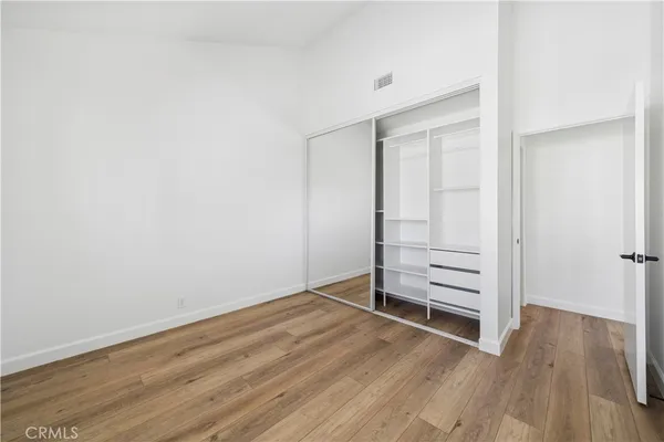 an empty room with wooden floor