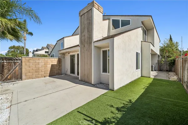 a backyard of a house with seating space