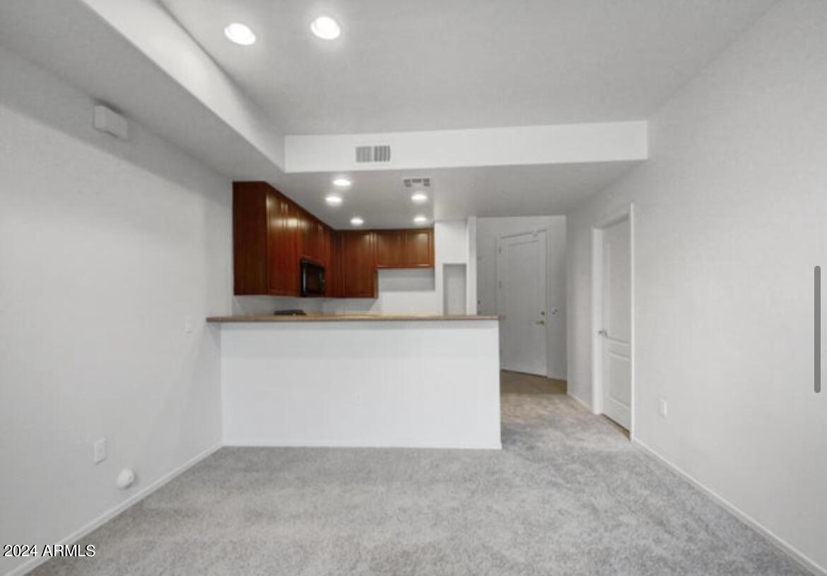 705 West Queen Creek Road, Unit 1207 Chandler, AZ 85248 - Photo 13 of 21 a view of a hallway