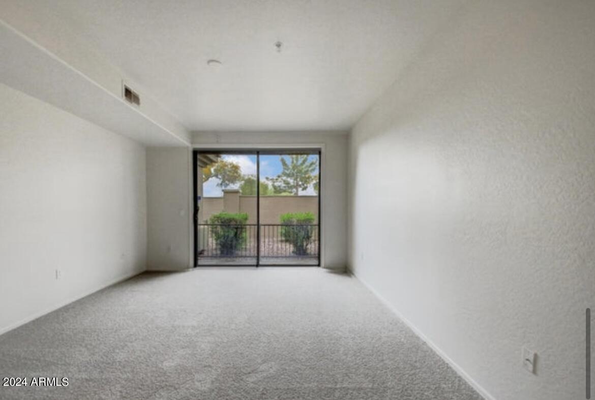705 West Queen Creek Road, Unit 1207 Chandler, AZ 85248 - Photo 15 of 21 a view of an empty room with a window