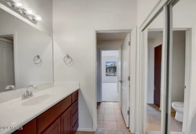 a bathroom with a double vanity sink and mirror