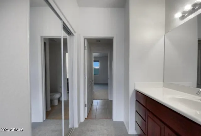 a view of a kitchen from the hallway