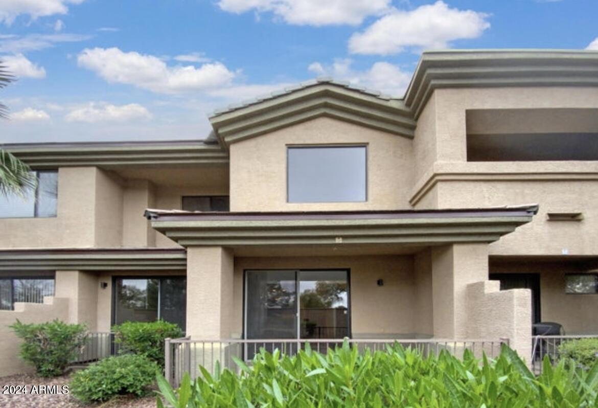 705 West Queen Creek Road, Unit 1207 Chandler, AZ 85248 - Photo 4 of 21 a house view with a outdoor space