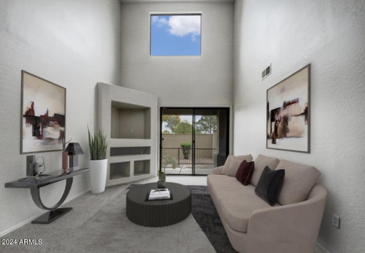 705 West Queen Creek Road, Unit 1207 Chandler, AZ 85248 - Photo 6 of 21 a living room with furniture and a potted plant