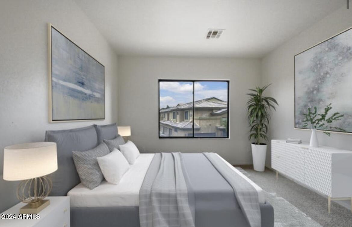 705 West Queen Creek Road, Unit 1207 Chandler, AZ 85248 - Photo 8 of 21 a bedroom with a bed and a painting on the wall