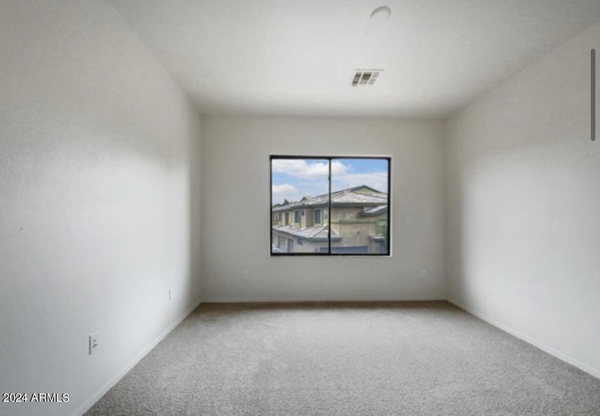 705 West Queen Creek Road, Unit 1207 Chandler, AZ 85248 - Photo 9 of 21 an empty room with window