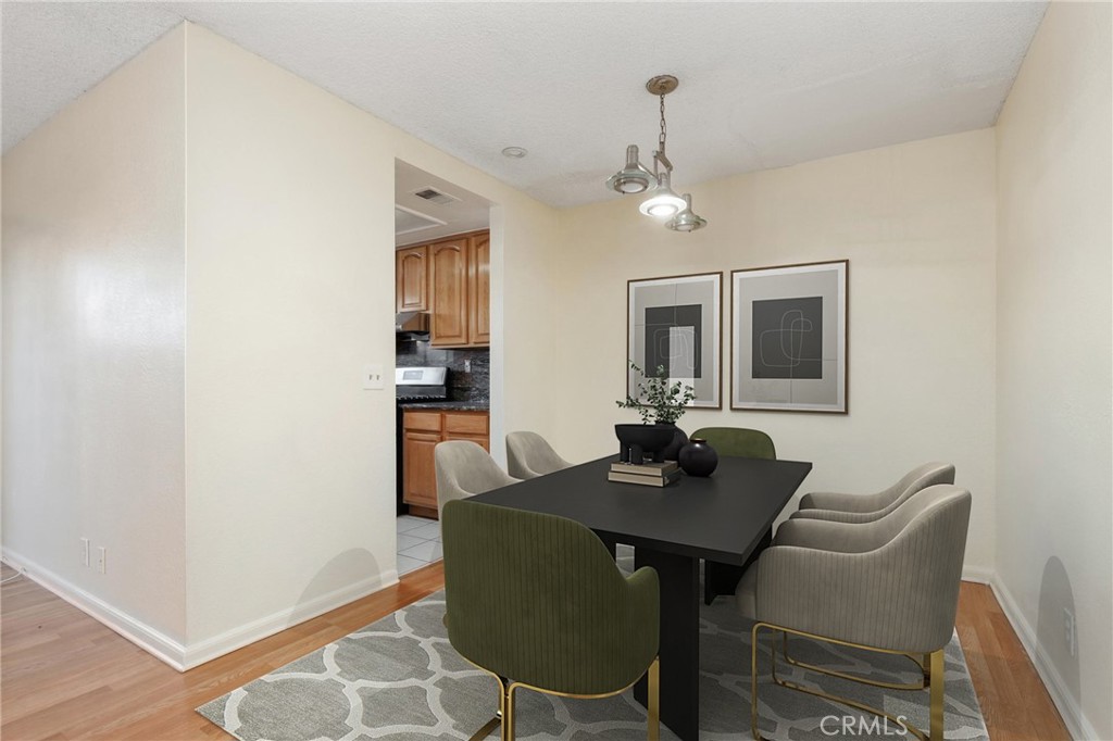 13522 Francisquito Avenue, Unit C Baldwin Park, CA 91706 - Photo 12 of 35 a view of a dining room with furniture and wooden floor