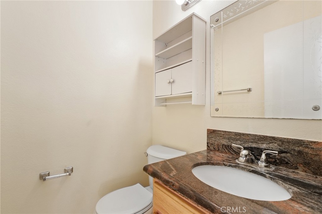 13522 Francisquito Avenue, Unit C Baldwin Park, CA 91706 - Photo 14 of 35 a bathroom with a sink toilet and mirror