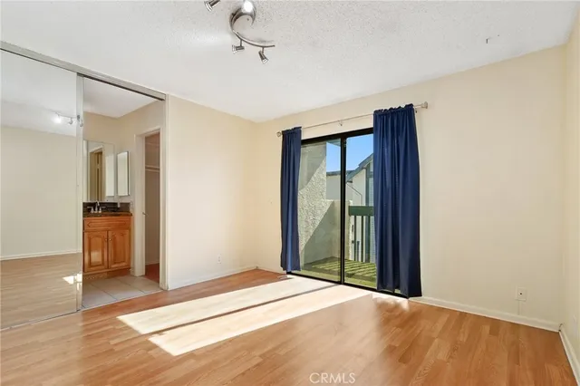 a bedroom with a bed and a view of bathroom
