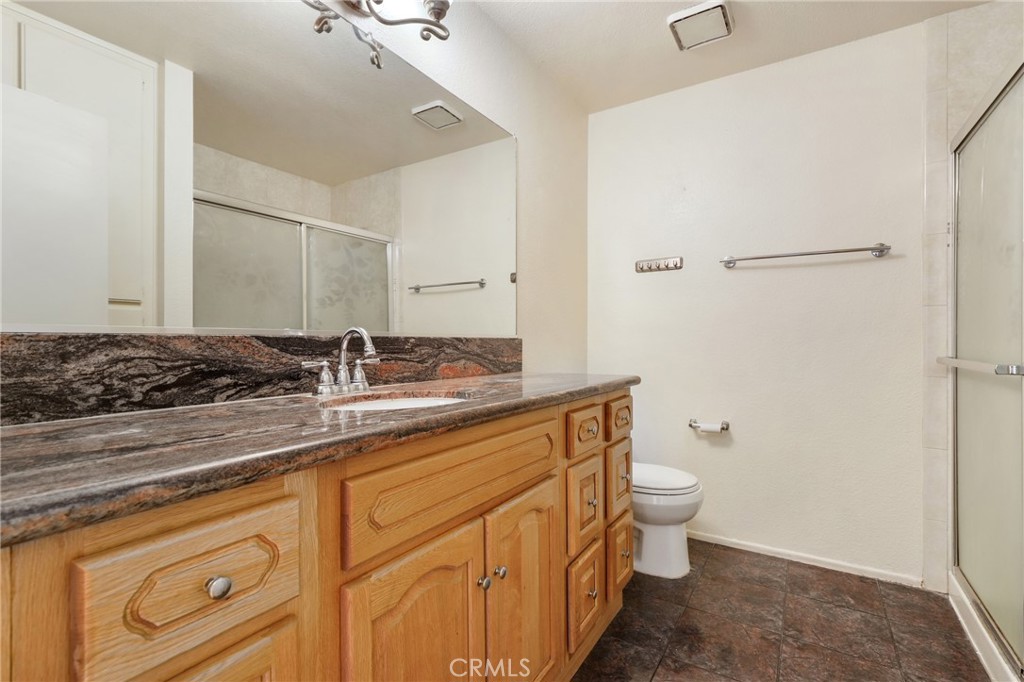 13522 Francisquito Avenue, Unit C Baldwin Park, CA 91706 - Photo 28 of 35 a bathroom with a granite countertop sink toilet and shower