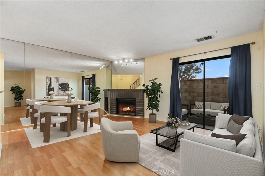13522 Francisquito Avenue, Unit C Baldwin Park, CA 91706 - Photo 3 of 35 a living room with furniture fireplace and a table