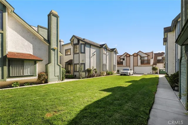a view of a front of a house with a yard