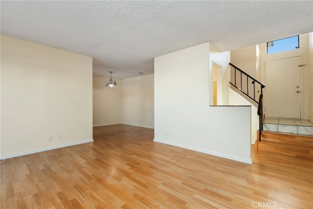 13522 Francisquito Avenue, Unit C Baldwin Park, CA 91706 - Photo 4 of 35 a view of an empty room with wooden floor