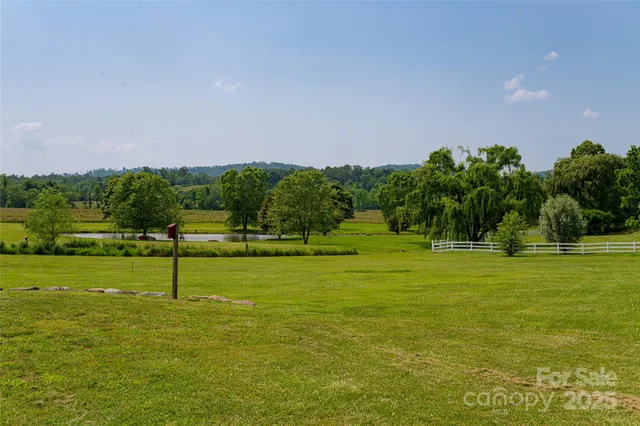a view of a garden with a building in the background