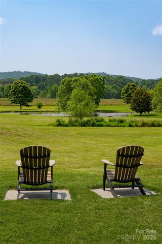 a view of a lake with a yard