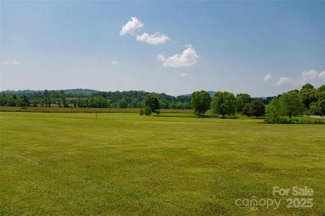 a view of a lake with a big yard