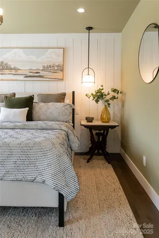 a bedroom with a sink and a table
