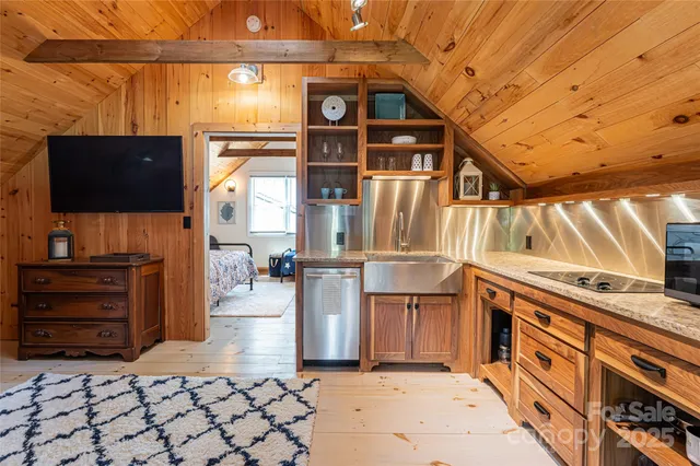 a view of a kitchen with furniture and a window