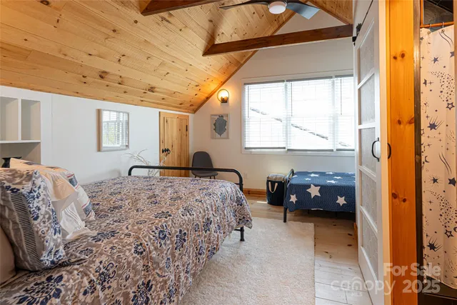 a bedroom with bed and window