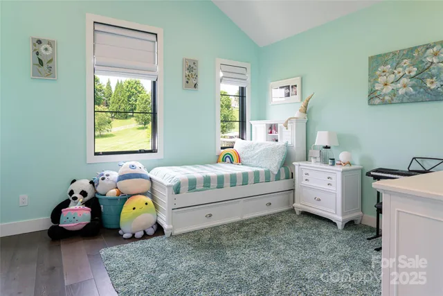 a bedroom with bed and a window