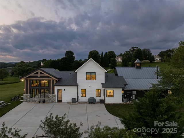 an aerial view of house with yard