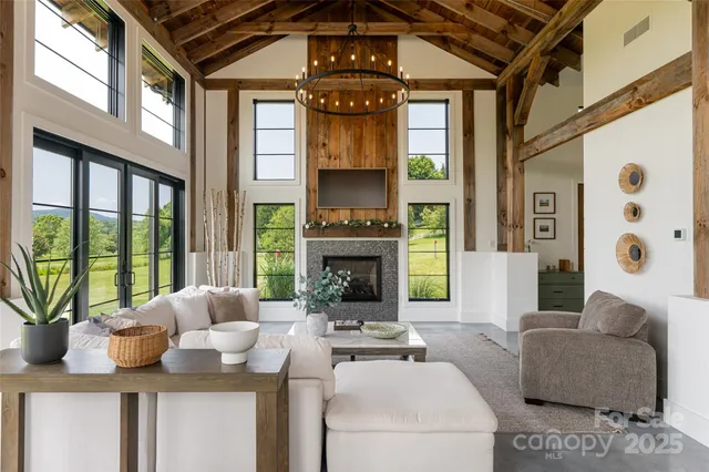 a living room with furniture fireplace and flat screen tv