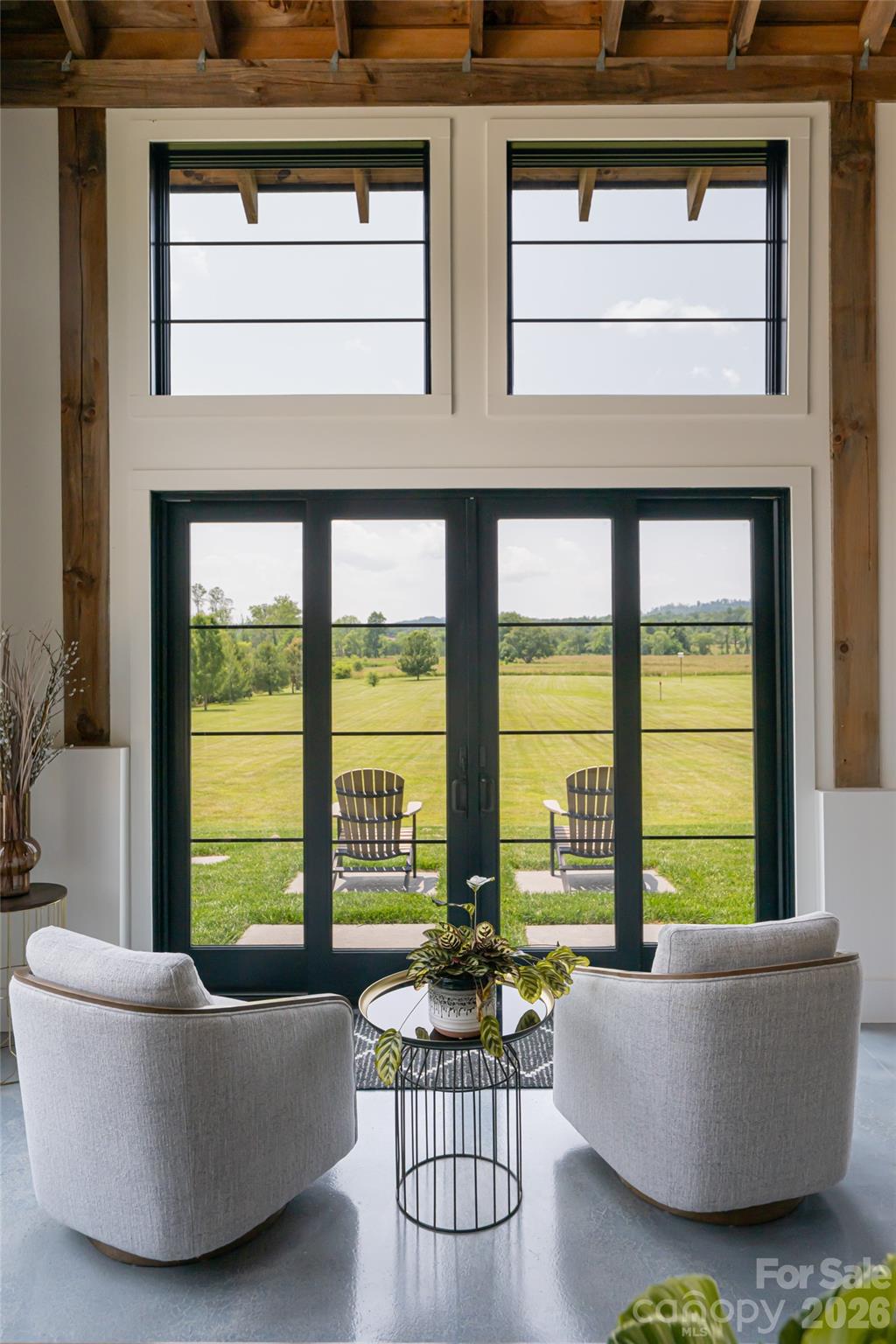 30 Greene Lane Fletcher, NC 28732 - Photo 9 of 48 a living room with furniture and floor to ceiling windows