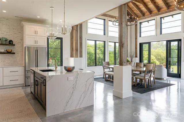 a view of kitchen with furniture and wooden floor