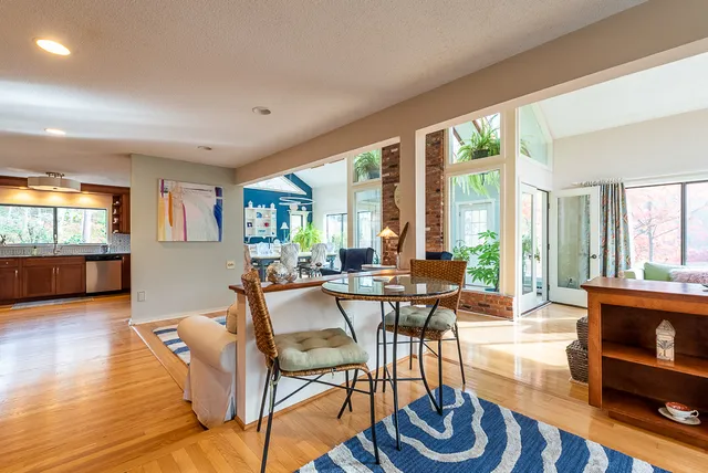 a view of a livingroom with furniture and book shelf
