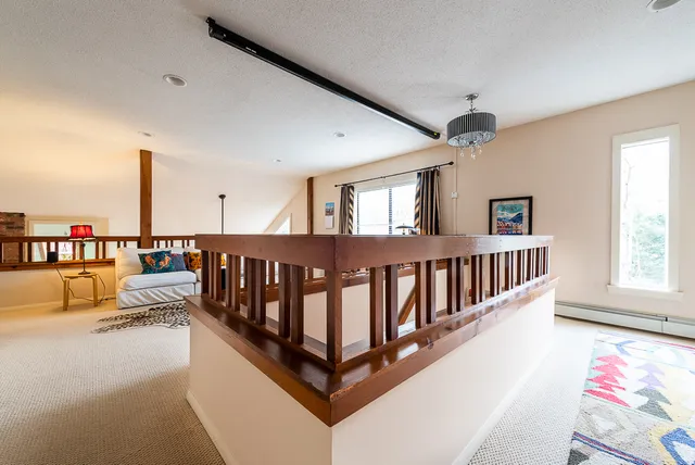 a view of a living room and a balcony