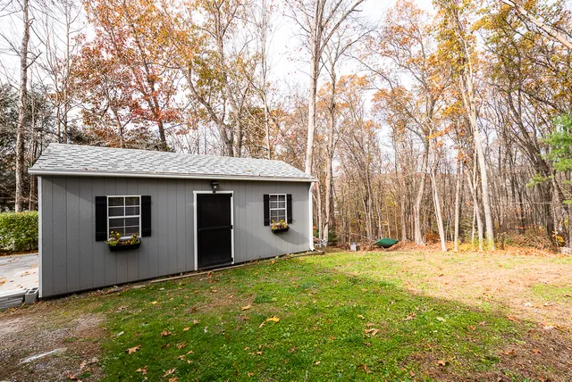 a view of a patio with table and chairs and wooden floor