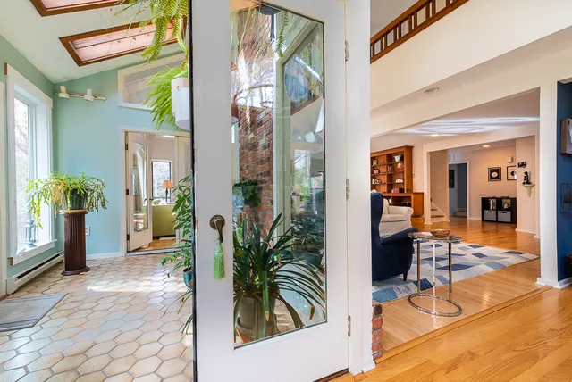 a view of an entryway with flower pots