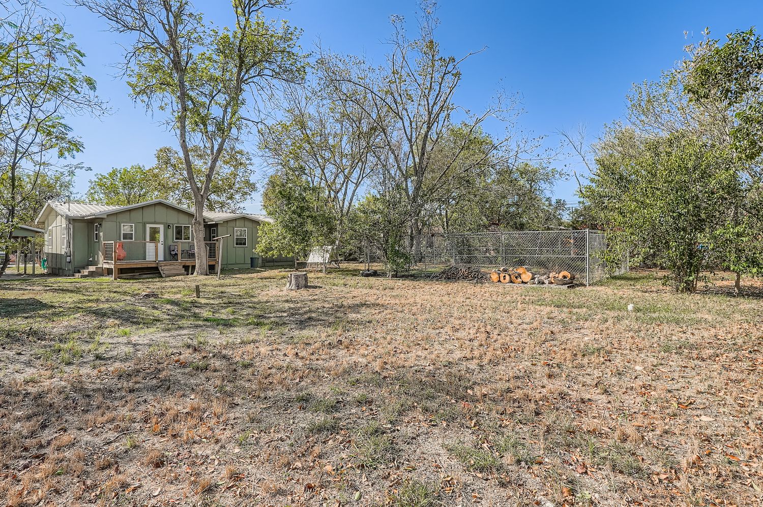 112 Tenorio Street Kyle, TX 78640 - Photo 11 of 11 a front view of a house with a yard
