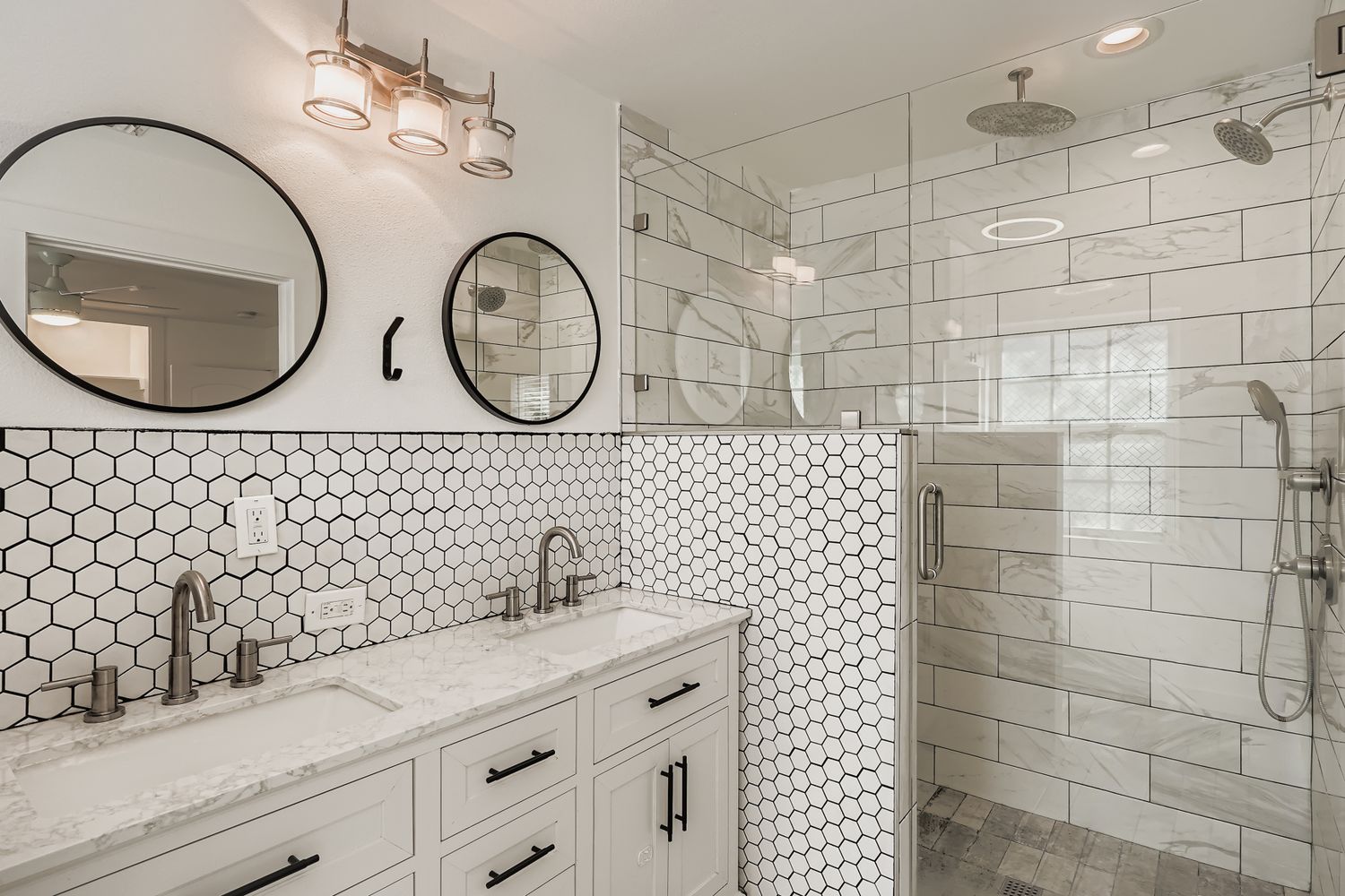 112 Tenorio Street Kyle, TX 78640 - Photo 6 of 11 a bathroom with a double vanity sink and a mirror